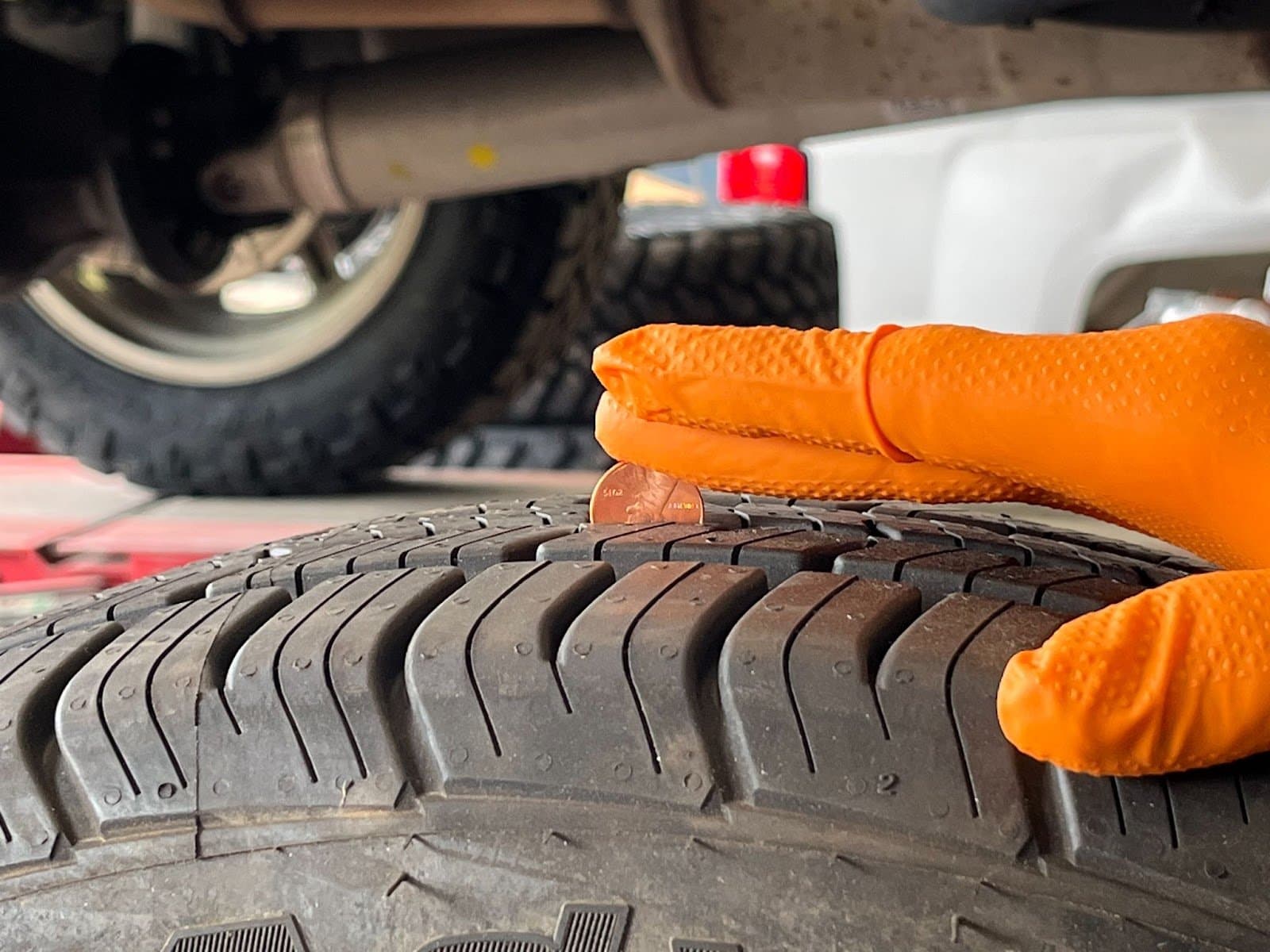 Penny method to test tread on tire at Carryl Tire Co. in Jacksonville, FL