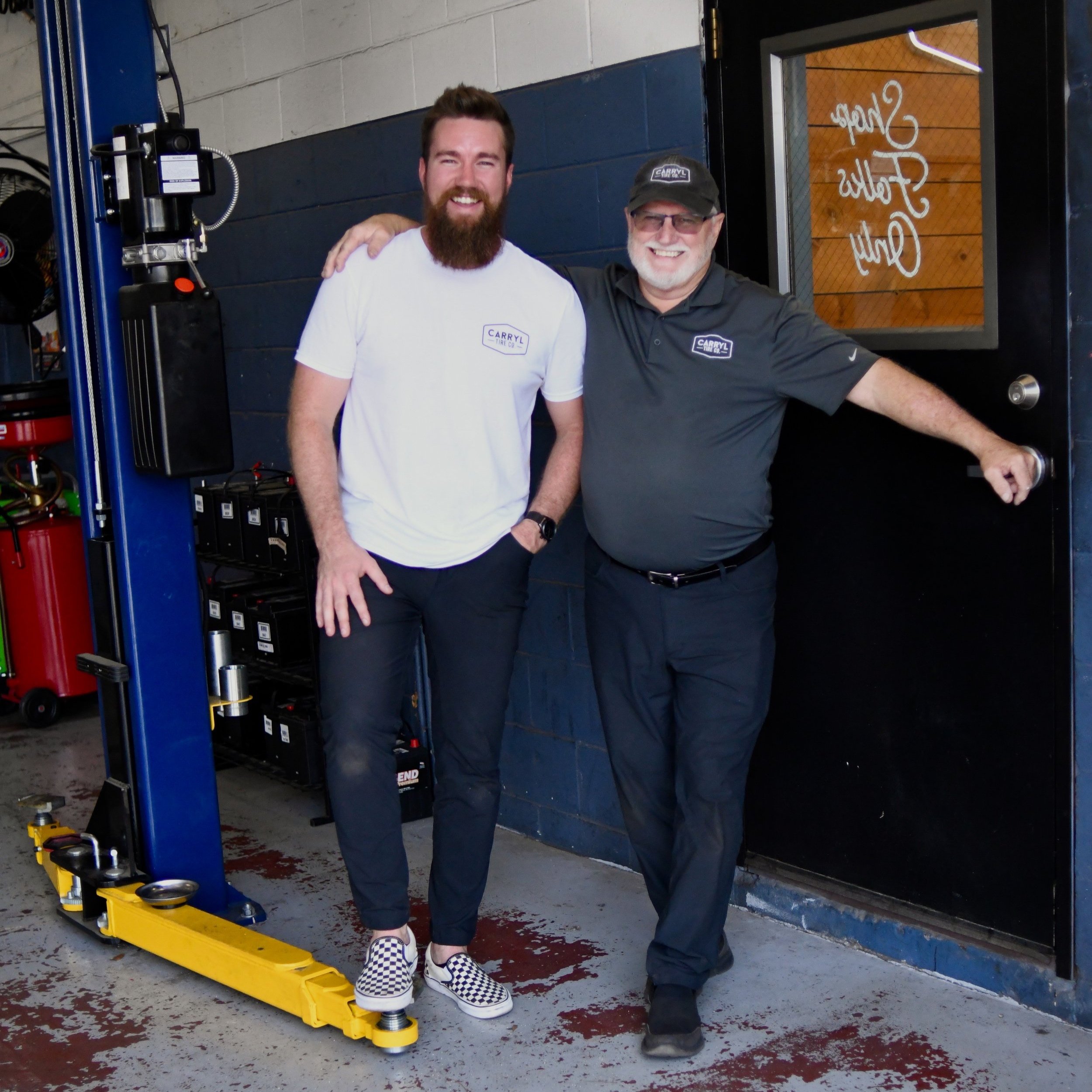 Two friendly employees at Carry Tire Co. in Jacksonville, FL